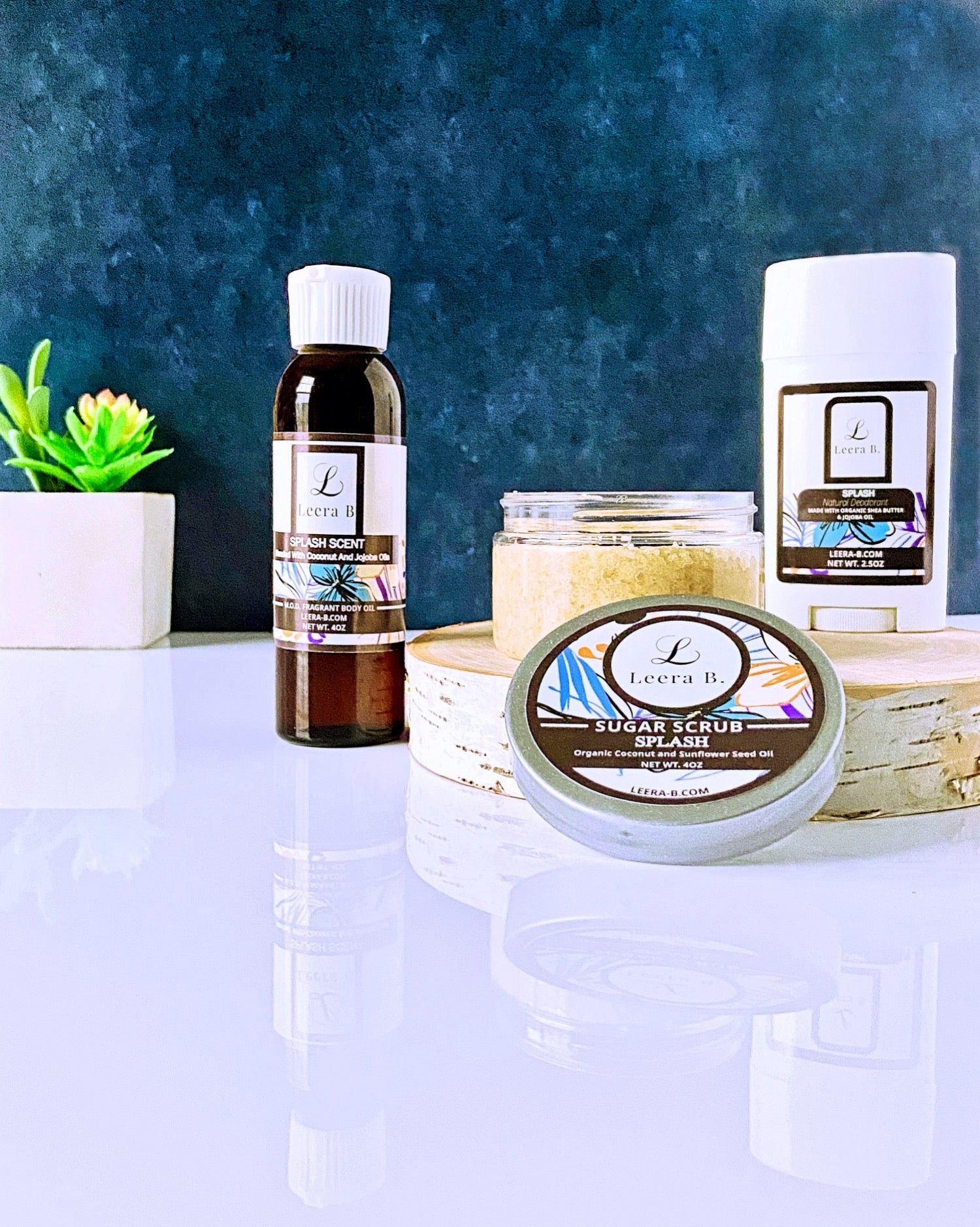 body oil, deodorant, and sugar scrub by leera b.